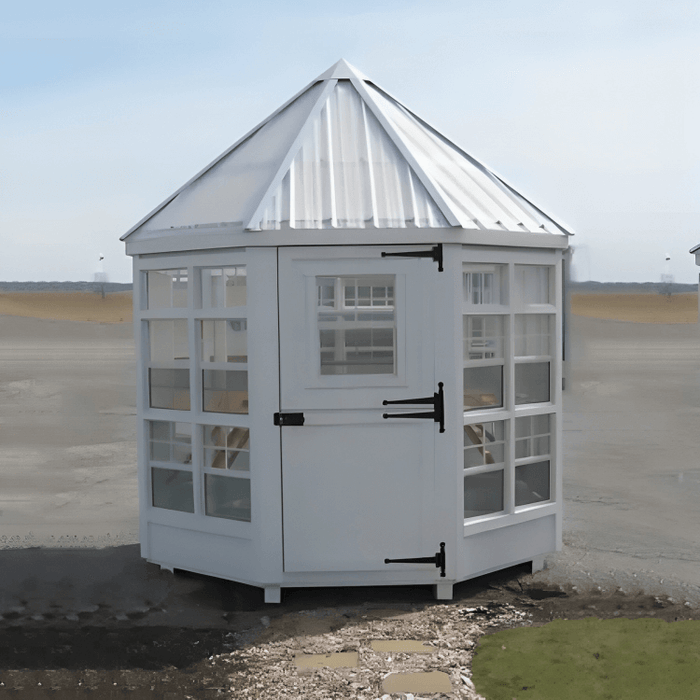 little cottage company 8x8 octagon greenhouse in an open field