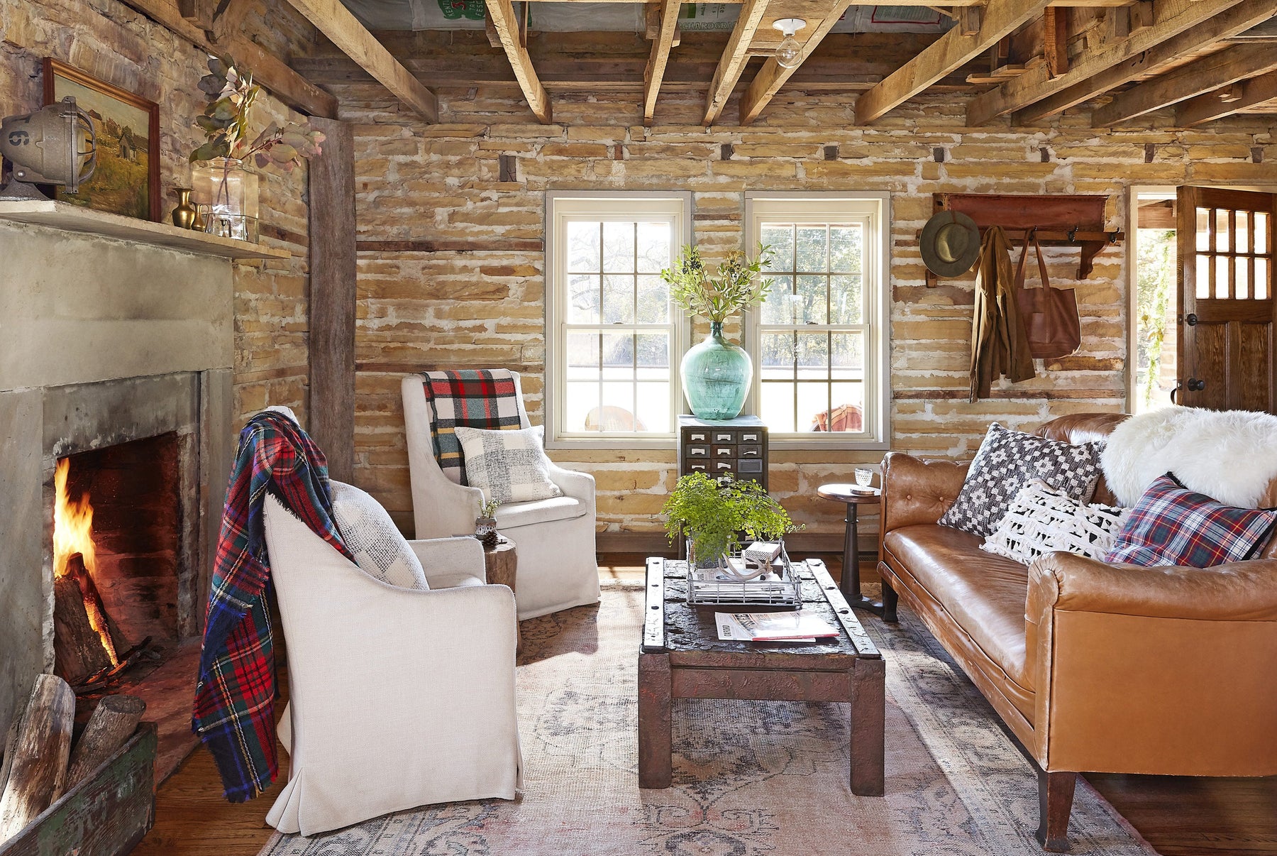 Cozy rustic living room with fireplace for seasonal home decorating