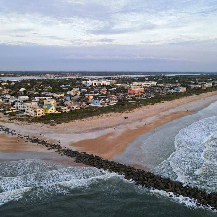 Coastal town beside the sea at sunset