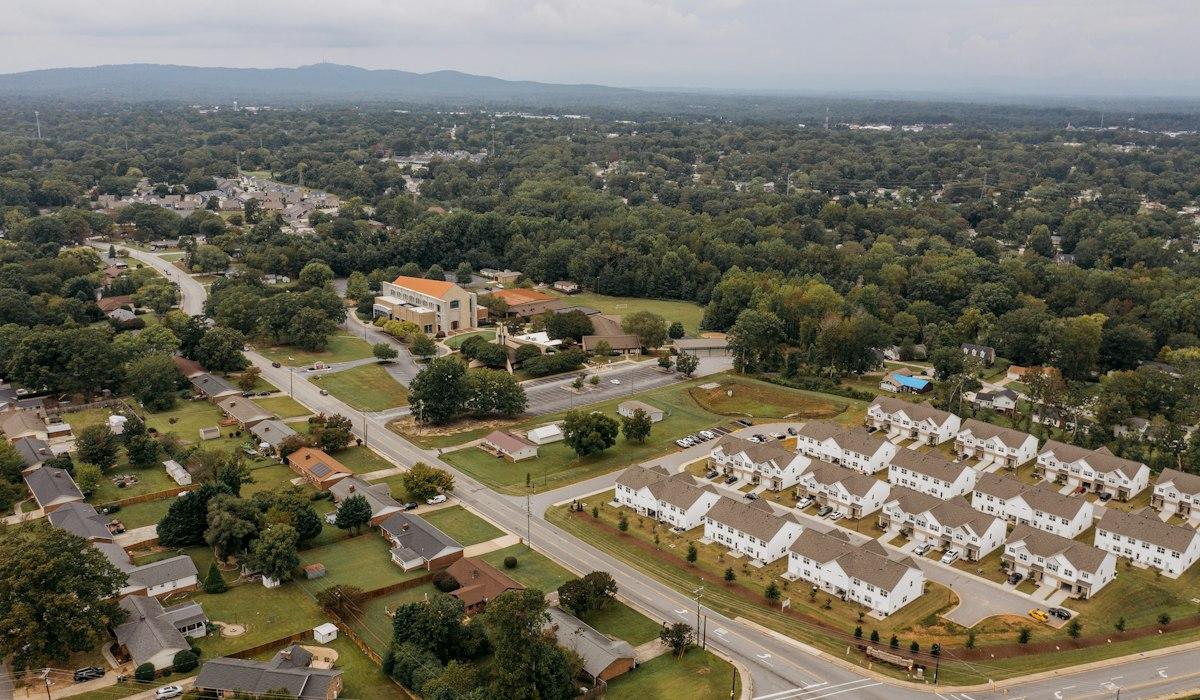 Aerial view of a suburban neighborhood with houses and trees