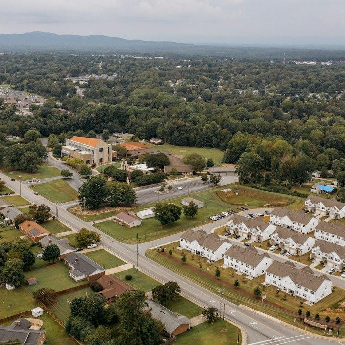 Aerial view of a suburban neighborhood with houses and trees