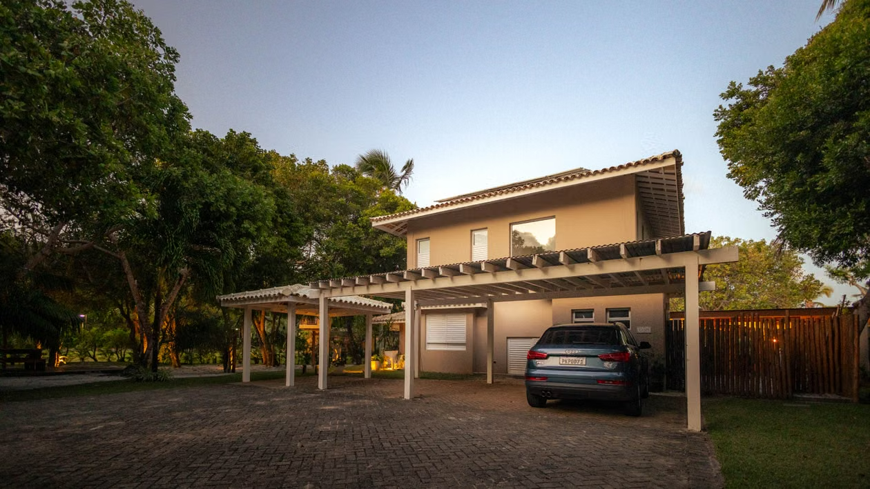 Modern home with a covered carport at twilight