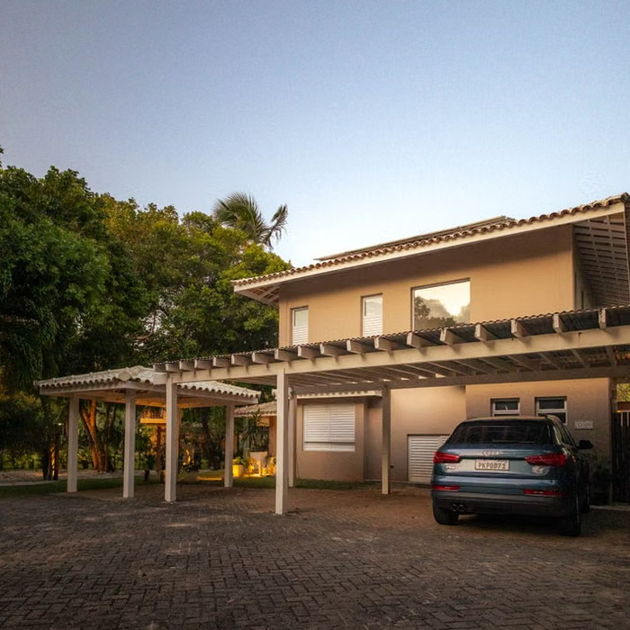 Modern home with a covered carport at twilight