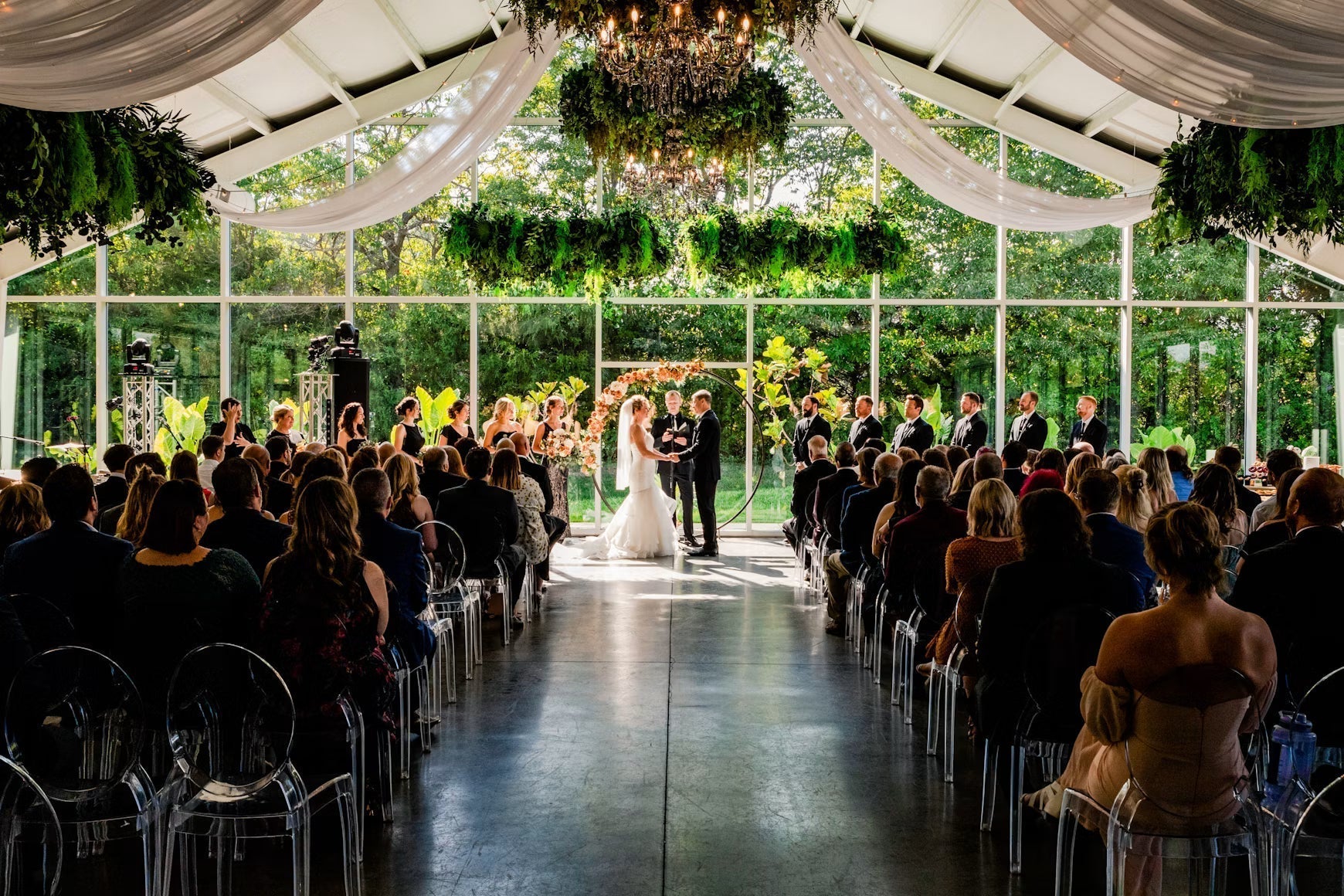 Wedding ceremony inside a glass greenhouse