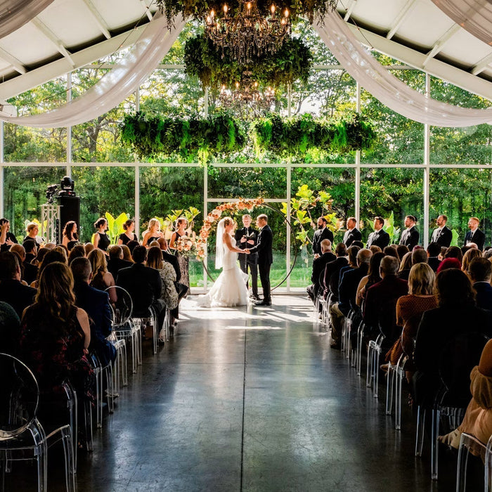 Wedding ceremony inside a glass greenhouse