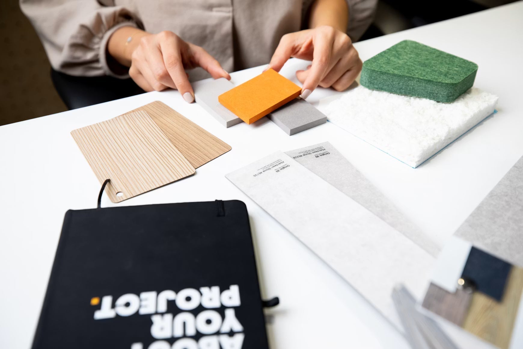 Remodeling material samples and plans spread across a worktable