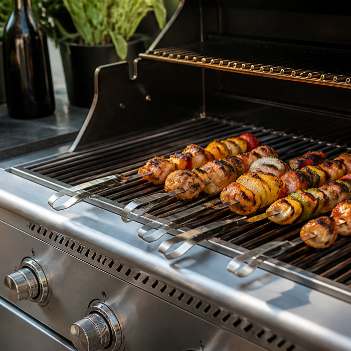Meat skewers cooking over a smoky barbecue grill