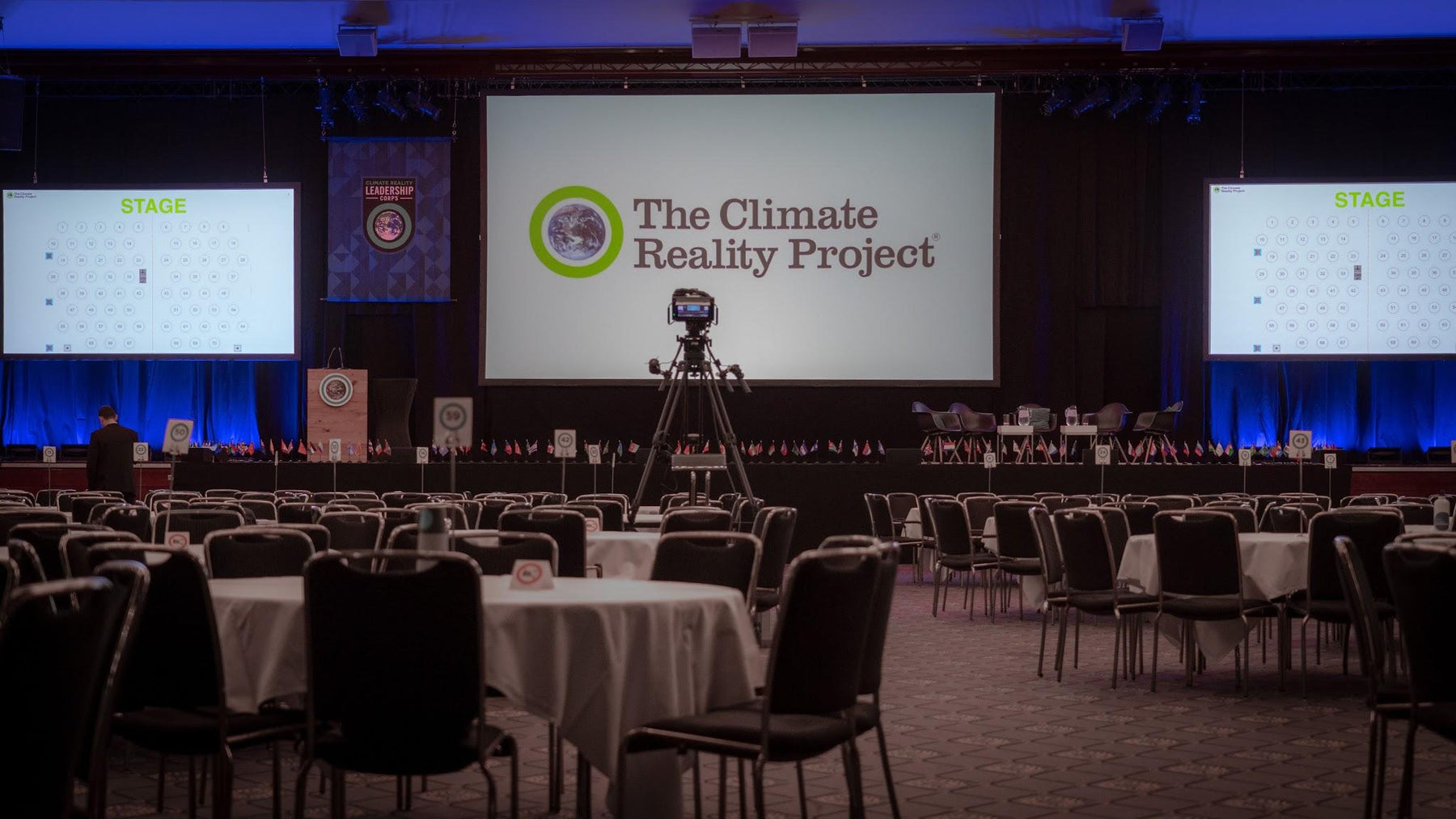 Large presentation screens in a conference venue