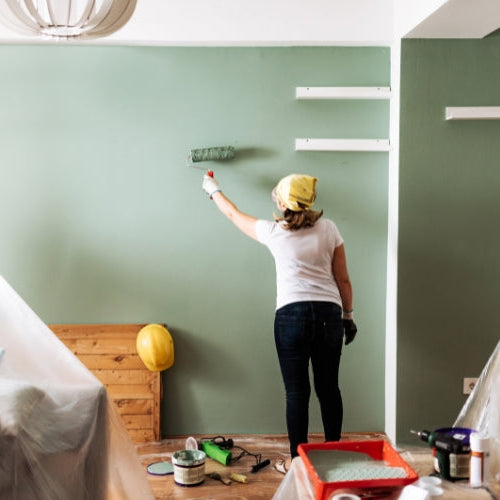 Homeowner wearing protective equipment while working on a DIY project