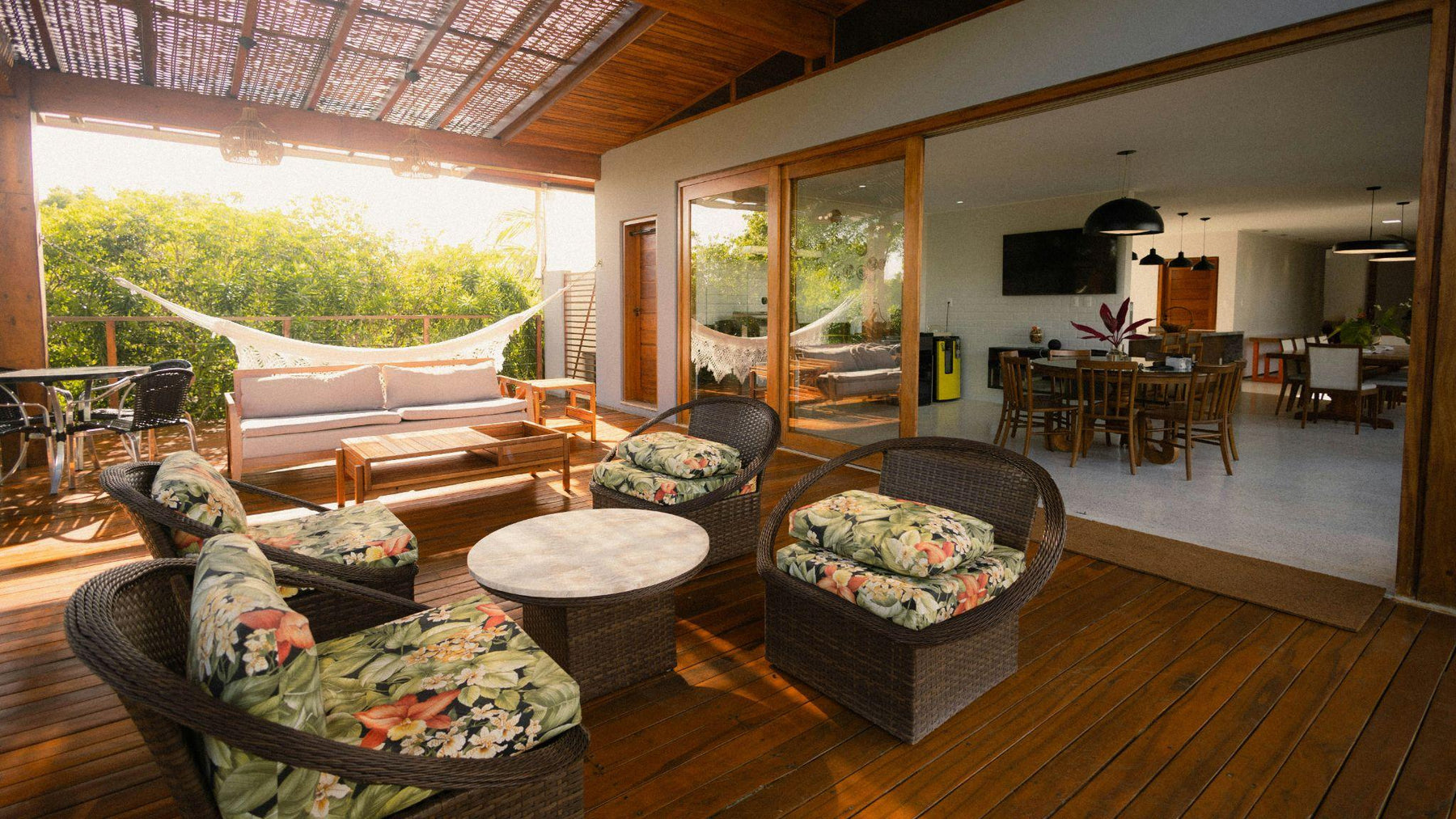 Covered outdoor patio with lounge and dining furniture