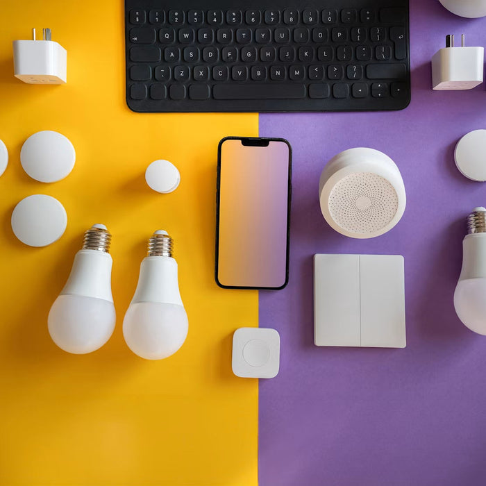 Smart home devices arranged beside a phone and keyboard