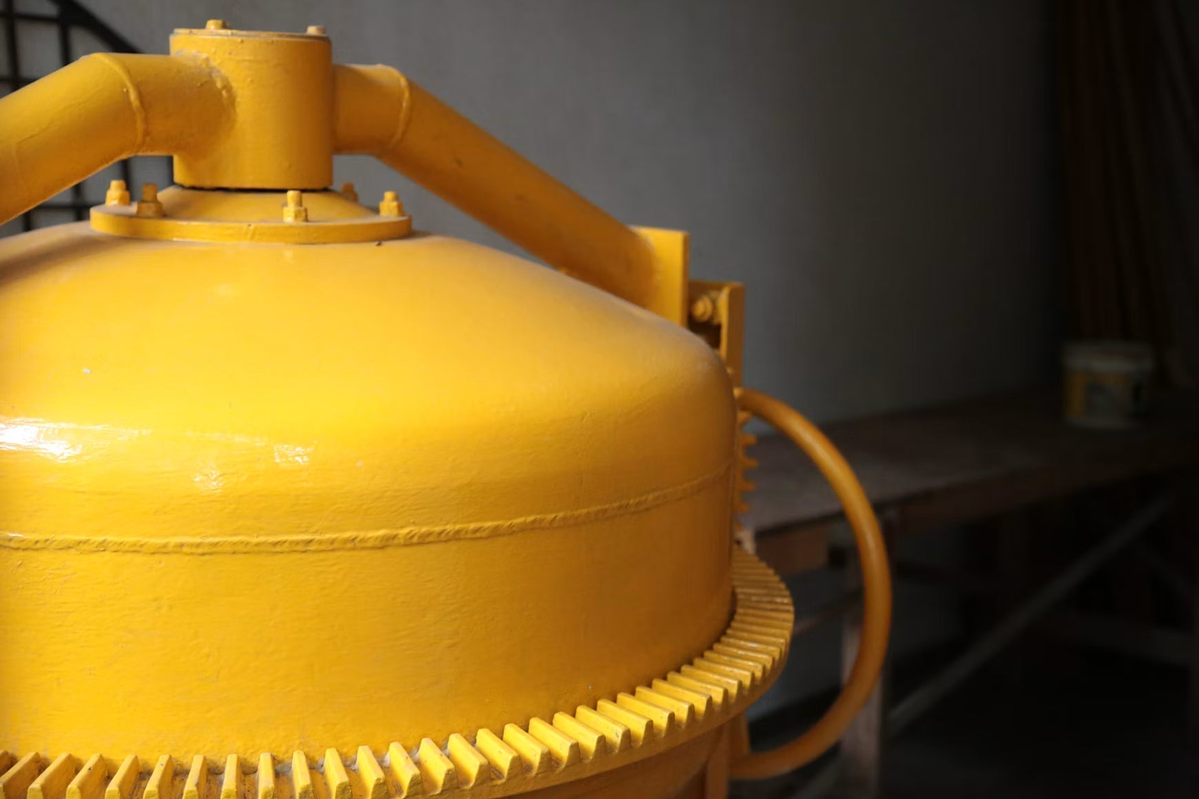 Close-up of a yellow pool sand filter system