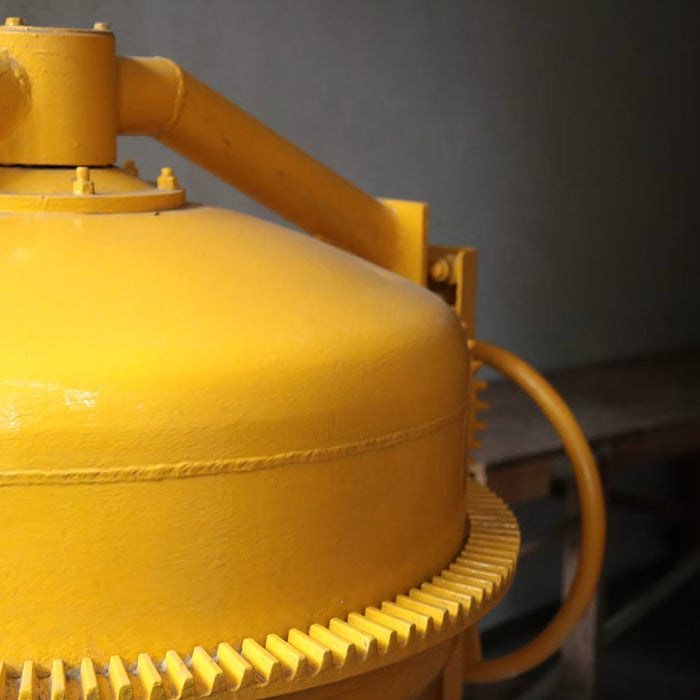 Close-up of a yellow pool sand filter system
