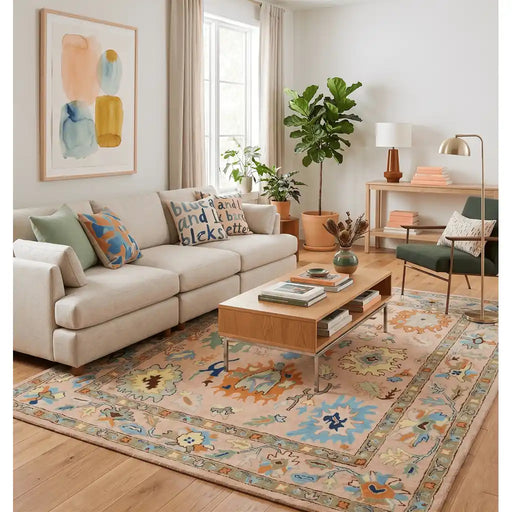 Peach Oushak rug styled beneath a coffee table in a living room