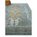 Traditional geometric pattern and blue border on hand knotted beige, blue and ivory wool rug