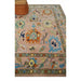 Angled rug corner beside a round ottoman