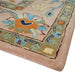 Rounded rug corner with floral border detail