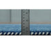 Side edge of the blue rug positioned beside a ruler