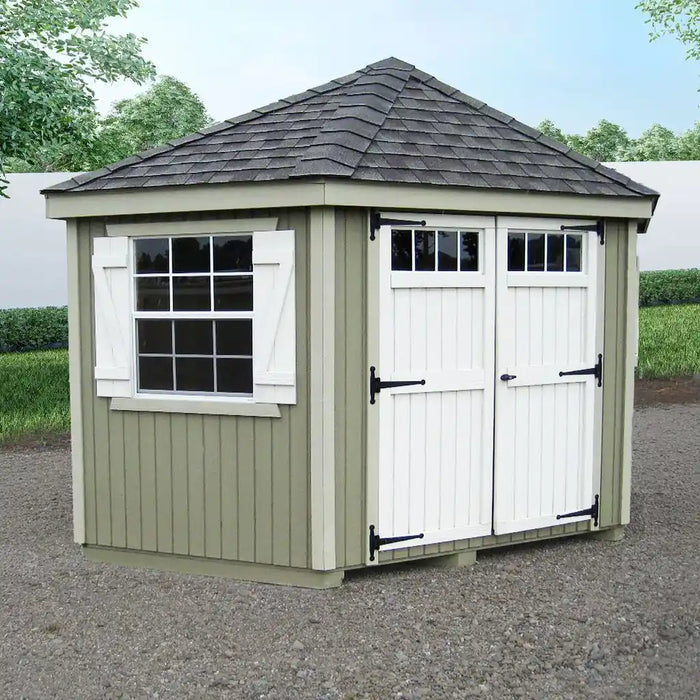 Little cottage co colonial five corner garden shed with white doors and windows, set against a natural background.