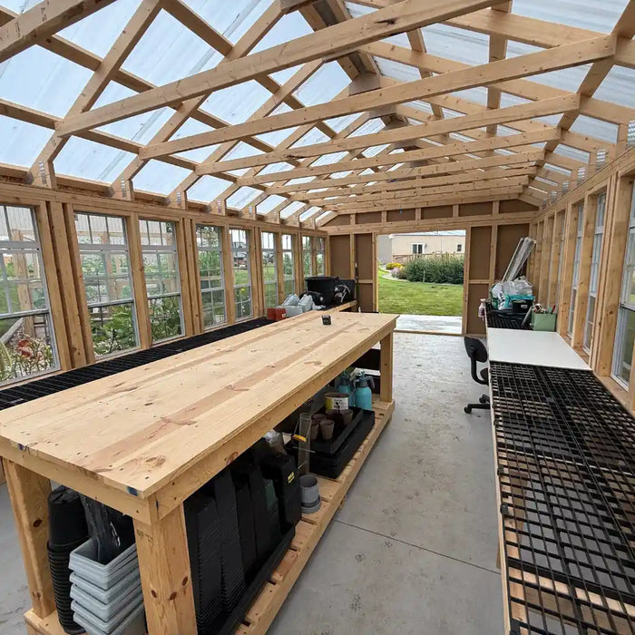 Ez fit greenhouse with a large workbench and transparent roof