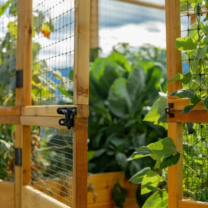 8x12 Deer Proof Raised Garden Bed with plants inside, set against a natural background