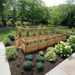 Outdoor Living Today 8x16 Deer Proof cedar raised garden bed with plants in a garden setting