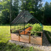 Outdoor Living Today 8x16 Raised Garden Bed with Bird Netting Cover in a backyard setting side view