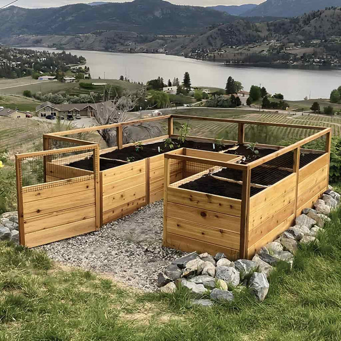 Outdoor Living Today 8x8 Raised Garden Bed side view with a scenic background of a lake and mountains.