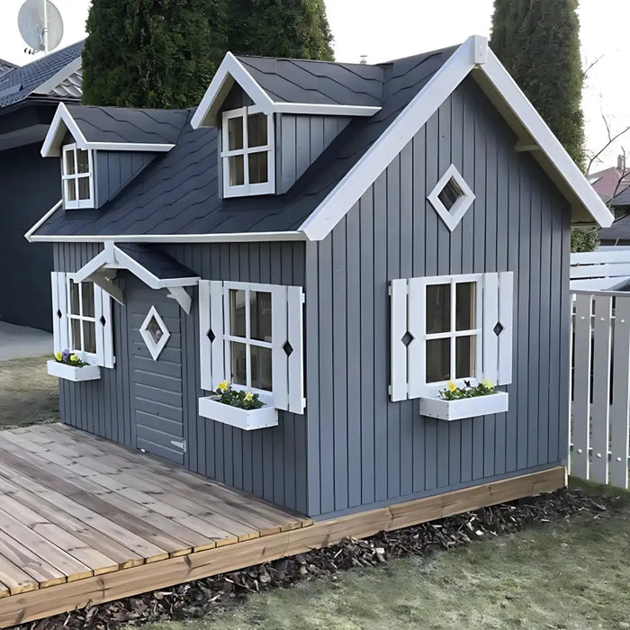 Palmako marie 9x6 playhouse kit with gray exterior and white trim on a grassy area