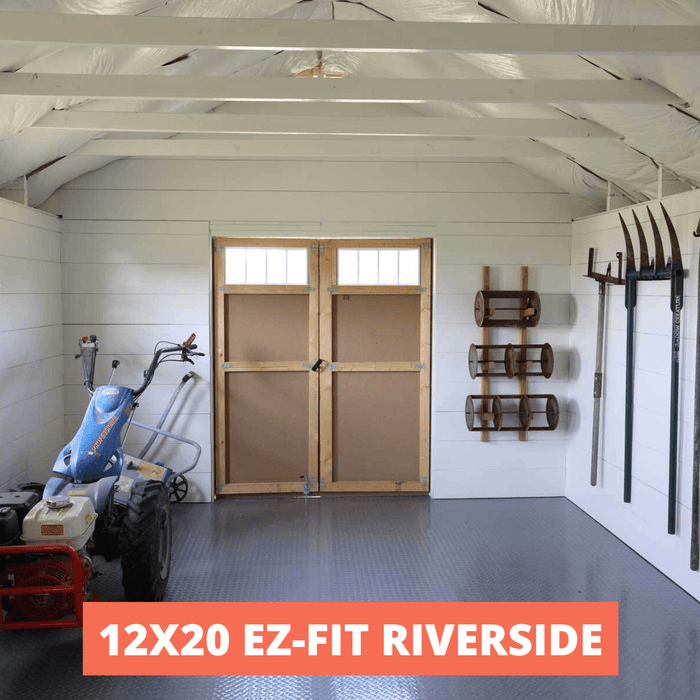 Interior of a spacious custom-built shed featuring built-in storage shelves and ample floor space.