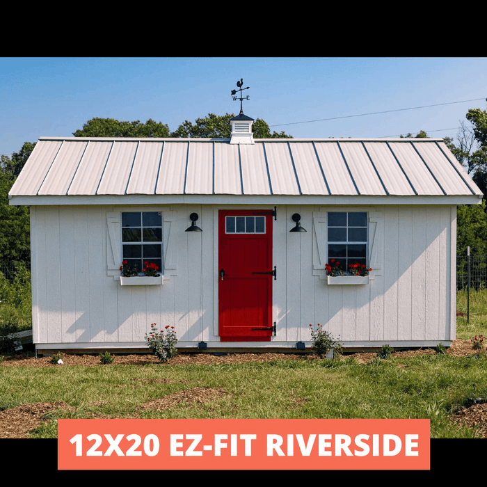 12x20 Riverside shed with white exterior, red door, and metal roof, featuring two windows with flower boxes in a green landscape