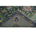 Folded rug corner showing the back and pile texture