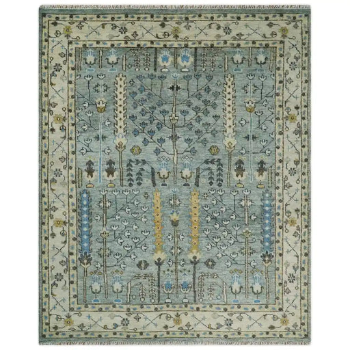 Full overhead view of the aqua and ivory Tree of Design rectangular rug