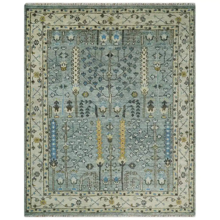 Full overhead view of the aqua and ivory Tree of Design rectangular rug