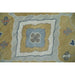Close view of geometric medallion and textured wool pile on traditional hand knotted rug