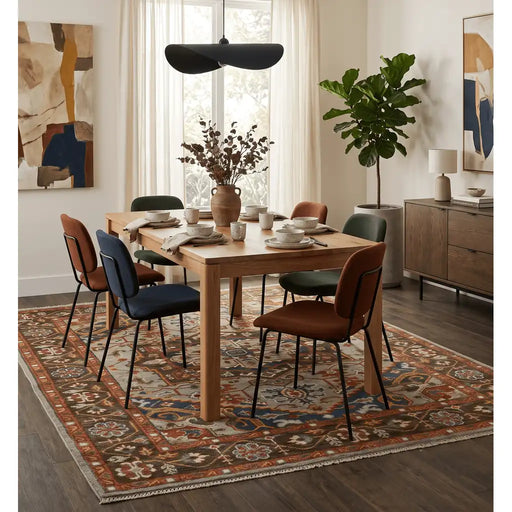 Blue and Brown Heriz Serapi rug in a staged dining room setting