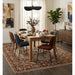 Blue and Brown Heriz Serapi rug in a staged dining room setting