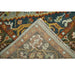 Folded corner showing the reverse and edge of the Blue and Brown rug