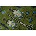 Closeup of blue and cream blossom details in the wool texture