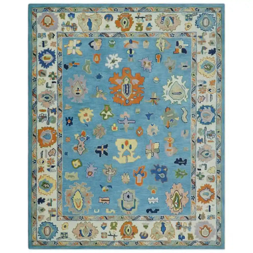 Front view of the blue and ivory Oushak rug showing the complete design