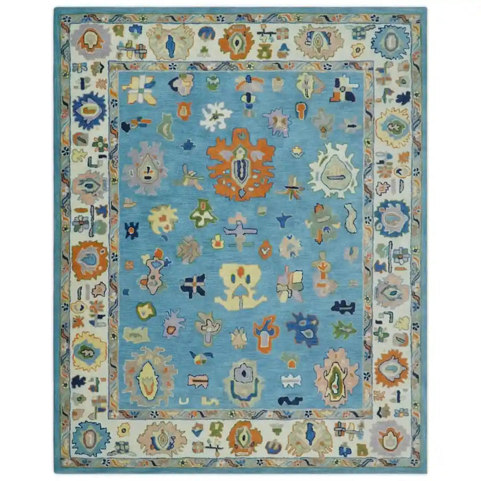 Front view of the blue and ivory Oushak rug showing the complete design