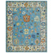 Front view of the blue and ivory Oushak rug showing the complete design