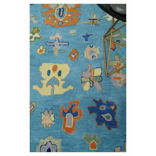 Close view of the blue and ivory Oushak rug pattern