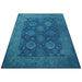 Upright angled view of the full blue Oushak rug on a white background
