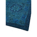 Close-up of the finished corner and edge of the blue wool rug