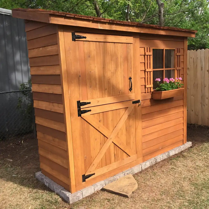 Cedarshed Bayside cedar storage shed in a yard with lean-to outdoor storage design.