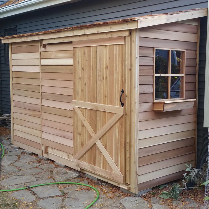 Cedarshed Bayside wide storage shed kit with cedar construction for bikes and tools.