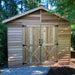 Front door view of the Cedarshed Rancher large shed kit in an outdoor yard setting