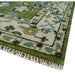 Closeup of the cream floral border and fringe