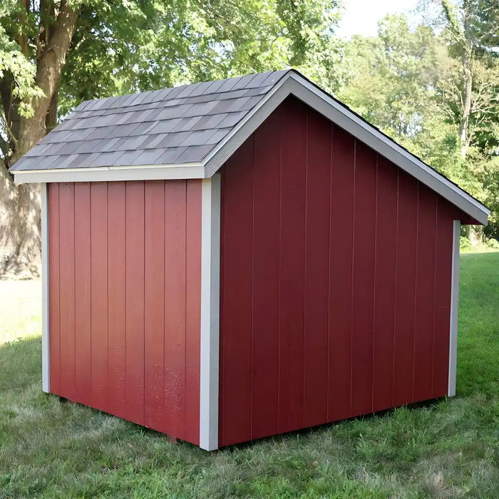 Back view of EZ-Fit 7x6 Playhouse Kit with a gray roof in a grassy area with trees.